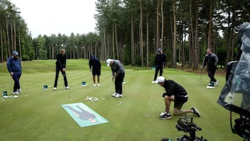 ST ALBANS, ENGLAND - JUNE 05: (L-R) Professional golfer Andrew Johnston, former footballers Peter Crouch and Jamie Redknapp, professional golfer Thomas Bjorn and TV presenter Piers Morgan watch as professional golfer Paul McGinley plays a shot during the 