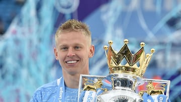 FILE PHOTO: Soccer Football - Premier League - Manchester City v Everton - Etihad Stadium, Manchester, Britain - May 23, 2021 Manchester City's Oleksandr Zinchenko poses with the trophy as he celebrates after winning the Premier League Pool via REUTERS/Peter Powell EDITORIAL USE ONLY. No use with unauthorized audio, video, data, fixture lists, club/league logos or 'live' services. Online in-match use limited to 75 images, no video emulation. No use in betting, games or single club /league/player publications. Please contact your account representative for further details./File Photo