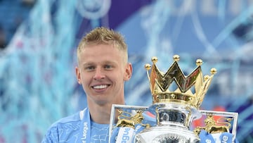 FILE PHOTO: Soccer Football - Premier League - Manchester City v Everton - Etihad Stadium, Manchester, Britain - May 23, 2021 Manchester City's Oleksandr Zinchenko poses with the trophy as he celebrates after winning the Premier League Pool via REUTERS/Peter Powell EDITORIAL USE ONLY. No use with unauthorized audio, video, data, fixture lists, club/league logos or 'live' services. Online in-match use limited to 75 images, no video emulation. No use in betting, games or single club /league/player publications.  Please contact your account representative for further details./File Photo