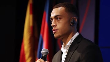 In this handout picture released by FC Barcelona, US defender Sergino Dest speaks during his official presentation as new player of FC Barcelona, at the Camp Nou stadium in Barcelona on October 2, 2020. (Photo by Miguel RUIZ / FC BARCELONA / AFP) / RESTRI