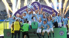 Manchester City&#039;s Vincent Kompany lifts the trophy as they celebrate winning the Premier League 