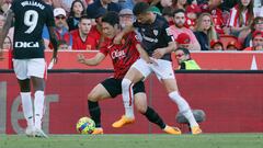 PALMA DE MALLORCA (BALEARES), 01/05/2023.- El centrocampista del Mallorca, Kang-In Lee (c) disputa una posesión con el delantero del Athletic Club Gorka Guruzeta (d) durante partido correspondiente a la jornada 32 de LaLiga Santander que Mallorca y Athletic Club disputan este lunes en el Visit Mallorca Estadi de Palma. EFE/ Cati Cladera
