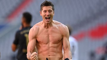 Bayern Munich&#039;s Polish forward Robert Lewandowski celebrates scoring his team&#039;s fifth goal during the German first division Bundesliga football match Bayern Munich vs FC Augsburg in Munich, southern Germany, on May 22, 2021. - Lewandowski scored