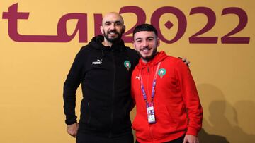 DOHA, QATAR - DECEMBER 13: Walid Regragui, Head Coach of Morocco, and Ilias Chair of Morocco pose for a photo during the Morocco Press Conference at the Main Media Center on December 13, 2022 in Doha, Qatar. (Photo by Maja Hitij - FIFA/FIFA via Getty Images)