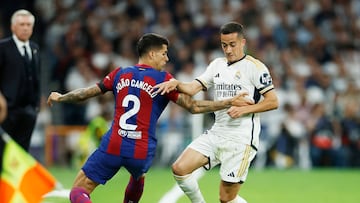 Soccer Football - LaLiga - Real Madrid v FC Barcelona - Santiago Bernabeu, Madrid, Spain - April 21, 2024 Real Madrid's Lucas Vazquez in action with FC Barcelona's Joao Cancelo REUTERS/Juan Medina