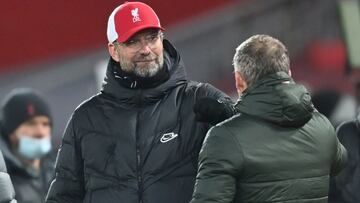 Soccer Football - Premier League - Liverpool v Manchester United - Anfield, Liverpool, Britain - January 17, 2021 Liverpool manager Juergen Klopp bumps fists with Manchester United manager Ole Gunnar Solskjaer after the match Pool via REUTERS/Michael Rega