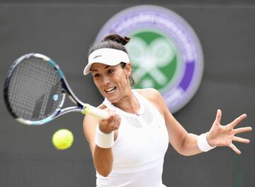 Muguruza in action at Wimbledon