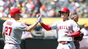 OAKLAND, CALIFORNIA - APRIL 01: Shohei Ohtani #17 is congratulated by Mike Trout #27 of the Los Angeles Angels after he scored against the Oakland Athletics in the third inning at RingCentral Coliseum on April 01, 2023 in Oakland, California.   Ezra Shaw/Getty Images/AFP (Photo by EZRA SHAW / GETTY IMAGES NORTH AMERICA / Getty Images via AFP)