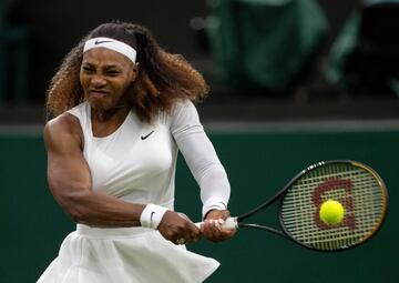 LONDON, ENGLAND - JUNE 29: Serena Williams of The United States winces in pain as she plays a backhand in her Ladies' Singles First Round match against Aliaksandra Sasnovich of Belarus during Day Two of The Championships - Wimbledon 2021 at All England La