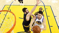 Jun 5, 2016; Oakland, CA, USA; Golden State Warriors guard Klay Thompson (11) shoots the ball against Cleveland Cavaliers forward Kevin Love (0) in game two of the NBA Finals at Oracle Arena. Mandatory Credit: Bob Donnan-USA TODAY Sports