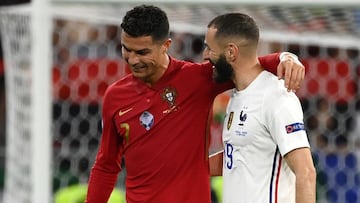 BUDAPEST, HUNGARY - JUNE 23: Karim Benzema of France interacts with Cristiano Ronaldo of Portugal during the UEFA Euro 2020 Championship Group F match between Portugal and France at Puskas Arena on June 23, 2021 in Budapest, Hungary. (Photo by Franck Fife