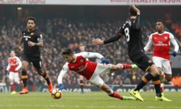 Britain Soccer Football - Arsenal v Hull City - Premier League - Emirates Stadium - 11/2/17 Arsenal's Alexis Sanchez is booked for simulation after this challenge by Hull City's Andrea Ranocchia Action Images via Reuters / John Sibley Livepic EDITORIAL USE ONLY. No use with unauthorized audio, video, data, fixture lists, club/league logos or "live" services. Online in-match use limited to 45 images, no video emulation. No use in betting, games or single club/league/player publications. Please contact your account representative for further details.