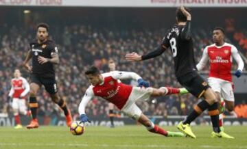 Britain Soccer Football - Arsenal v Hull City - Premier League - Emirates Stadium - 11/2/17 Arsenal's Alexis Sanchez is booked for simulation after this challenge by Hull City's Andrea Ranocchia  Action Images via Reuters / John Sibley Livepic EDITORIAL USE ONLY. No use with unauthorized audio, video, data, fixture lists, club/league logos or "live" services. Online in-match use limited to 45 images, no video emulation. No use in betting, games or single club/league/player publications.  Please contact your account representative for further details.