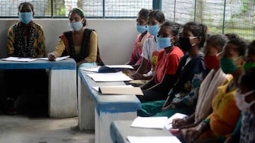 Youths from Merry view Tea Garden organisation attend a class as part of 'Tuition for Rs 10' project, origanized by Indian couple Anirban Nandy and Poulami Chaki Nandy for underprivileged students unable to assist online classes at Hatighisa vil