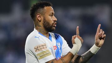 Hilal's Brazilian forward #10 Neymar speaks to teammates during the Saudi Pro League football match between Damac FC and Al-Hilal SFC at Prince Sultan bin Abdul Aziz Stadium in Abha on September 21, 2023. (Photo by AFP)