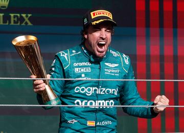 Formula One F1 - Brazilian Grand Prix - Jose Carlos Pace Circuit, Sao Paulo, Brazil - November 5, 2023 Aston Martin's Fernando Alonso celebrates with a trophy on the podium after finishing third place in the Brazilian Grand Prix REUTERS/Amanda Perobelli