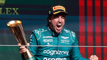 Formula One F1 - Brazilian Grand Prix - Jose Carlos Pace Circuit, Sao Paulo, Brazil - November 5, 2023 Aston Martin's Fernando Alonso celebrates with a trophy on the podium after finishing third place in the Brazilian Grand Prix REUTERS/Amanda Perobelli