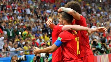 Belgium's midfielder Kevin De Bruyne (L) is congratulated by teammates after scoring his team's second goal during the Russia 2018 World Cup quarter-final football match between Brazil and Belgium at the Kazan Arena in Kazan on July 6, 2018. / A