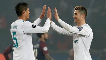 Soccer Football - Champions League Round of 16 Second Leg - Paris St Germain vs Real Madrid - Parc des Princes, Paris, France - March 6, 2018 Real Madrid’s Cristiano Ronaldo and Raphael Varane celebrate after the match REUTERS/Benoit Tessier