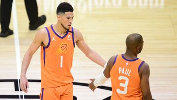 Jun 30, 2021; Los Angeles, California, USA; Phoenix Suns guard Chris Paul (3) celebrates with guard Devin Booker (1) after scoring a basket against the Los Angeles Clippers during the second half in game six of the Western Conference Finals for the 2021 NBA Playoffs at Staples Center. Mandatory Credit: Gary A. Vasquez-USA TODAY Sports