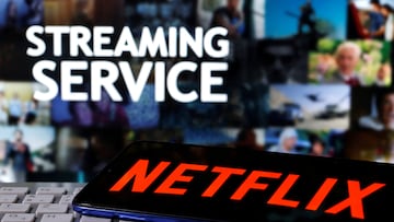 FILE PHOTO: A smartphone with the Netflix logo is seen on a keyboard in front of displayed "Streaming service" words in this illustration taken March 24, 2020. REUTERS/Dado Ruvic/File Photo