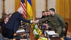 U.S. President Joe Biden and Ukraine President Volodymyr Zelenskiy shake hands across the table during a meeting in the East Room of the White House in Washington, U.S. September 21, 2023. REUTERS/Kevin Lamarque