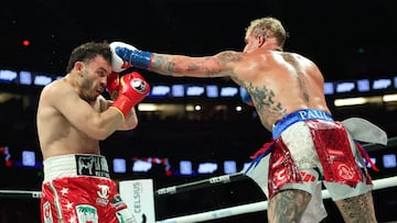 USA's Jake Paul (R) and Mexico's Julio Cesar Chavez Jr. fight during their cruiserweight boxing bout at the Honda Center in Anaheim, California, on June 28, 2025. (Photo by Patrick T. Fallon / AFP)