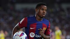 Barcelona's Spanish forward #10 Ansu Fati runs with the ball during the Spanish Liga football match between FC Barcelona and Cadiz CF at the Lluis Companys Olimpic Stadium in Barcelona on August 20, 2023. (Photo by LLUIS GENE / AFP)