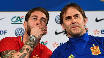 (From L) Spain's defender Sergio Ramos jokes with Spain's head coach Julen Lopetegui during a press conference at the Stade de France stadium in Saint-Denis, north of Paris, on March 27, 2017 on the eve of the friendly football match Spain again