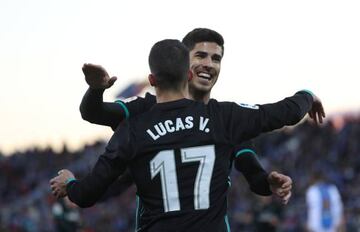 Real Madrid’s Lucas Vazquez celebrates with Marco Asensio after scoring their first goal.