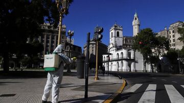 FILE PHOTO: A worker disinfects Plaza de Mayo after Argentina's President Alberto Fernandez announced a mandatory quarantine as a measure to curb the spread of coronavirus disease (COVID-19), in Buenos Aires, Argentina March 20, 2020. REUTERS/Matias Baglietto/File Photo