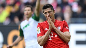Bayern Munich's Polish striker Robert Lewandowski reacts during the German first division Bundesliga football match FC Bayern Munich vs FC Augsburg in Augsburg, southern Germany, on October 19, 2019. (Photo by Christof STACHE / AFP) / RESTRICTIONS: D