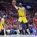 (FILES) LeBron James #23 of the Los Angeles Lakers shoots as Zion Williamson #1 of the New Orleans Pelicans defends during the second half of a play-in tournament game at the Smoothie King Center on April 16, 2024 in New Orleans, Louisiana. NOTE TO USER: User expressly acknowledges and agrees that, by downloading and or using this Photograph, user is consenting to the terms and conditions of the Getty Images License Agreement. James will return to the Los Angeles Lakers next season after agreeing a new two-year $104 million deal with the club, multiple US reports said on July 3, 2024. James, who will turn 40 in December, opted out of his existing deal with the club last week in a move analysts said would free up more money to recruit new players. (Photo by Jonathan Bachman / GETTY IMAGES NORTH AMERICA / AFP)