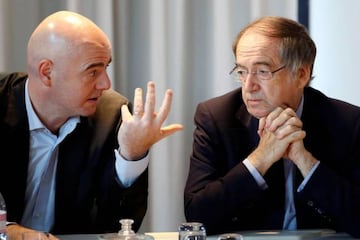 FIFA President Gianni Infantino (L) and Noel le Graet, head of the French soccer Federation (FFF), speak during a news conference