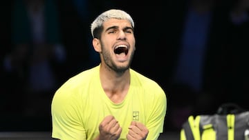 Spain's Carlos Alcaraz celebrates after winning against Italy's Lorenzo Musetti at the ATP Finals tennis tournament in Turin on November 13, 2025. (Photo by Marco BERTORELLO / AFP)