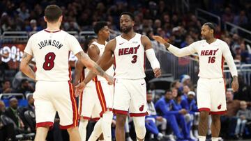 Dec 23, 2018; Orlando, FL, USA; Miami Heat guard Dwyane Wade (3), guard Tyler Johnson (8), forward James Johnson (16) and teammates high give against the Orlando Magic during the second half at Amway Center. Mandatory Credit: Kim Klement-USA TODAY Sports