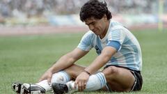 (FILES) In this file photo taken on June 02, 1986 Argentina's player Diego Maradona sits on the ground after a fall during the match Argentina vs. South Korea as part of the Football World Cup at Mexico City. - Eight medical personnel will stand trial for alleged criminal negligence in the death of Argentine football legend Diego Maradona, according to a court ruling made public on June 22, 2022. (Photo by AFP)