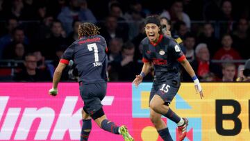 AMSTERDAM, NETHERLANDS - NOVEMBER 6: Erick Gutierrez of PSV celebrates 0-2 with Xavi Simons of PSV during the Dutch Eredivisie match between Ajax v PSV at the Johan Cruijff Arena on November 6, 2022 in Amsterdam Netherlands (Photo by Rico Brouwer/Soccrates/Getty Images)