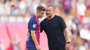 BARCELONA, SPAIN - AUGUST 31: Hansi Flick, Head Coach of FC Barcelona, interacts with Fermin Lopez of FC Barcelona following the La Liga match between FC Barcelona and Real Valladolid CF at Camp Nou on August 31, 2024 in Barcelona, Spain. (Photo by Alex Caparros/Getty Images)