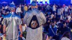 12 May 2022, Italy, Turin: Music fans in eye-catching silver outfits watch the live broadcast of the second semifinal of the Eurovision Song Contest (ESC) in the Eurovision Village in the city center. The international music competition is taking place for the 66th time. On 14.05.2022 the final of the international competition will take place, a total of 40 musicians have participated. Photo: Jens Büttner/dpa (Photo by Jens Büttner/picture alliance via Getty Images)