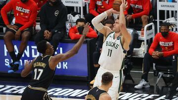 ATLANTA, GEORGIA - JULY 03: Brook Lopez #11 of the Milwaukee Bucks shoots against Onyeka Okongwu #17 of the Atlanta Hawks during the first half in Game Six of the Eastern Conference Finals at State Farm Arena on July 03, 2021 in Atlanta, Georgia NOTE TO USER: User expressly acknowledges and agrees that, by downloading and or using this photograph, User is consenting to the terms and conditions of the Getty Images License Agreement. Kevin C. Cox/Getty Images/AFP
== FOR NEWSPAPERS, INTERNET, TELCOS & TELEVISION USE ONLY ==