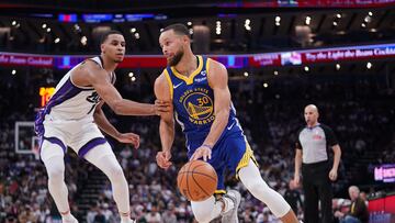 Apr 16, 2024; Sacramento, California, USA; Golden State Warriors guard Stephen Curry (30) dribbles past Sacramento Kings forward Keegan Murray (13) in the second quarter during a play-in game of the 2024 NBA playoffs at the Golden 1 Center. Mandatory Credit: Cary Edmondson-USA TODAY Sports