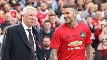 MANCHESTER, ENGLAND - MAY 26:  David Beckham of Manchester United &#039;99 Legends walks out with Manchester United &#039;99 Legends Manager Sir Alex Ferguson prior to the 20 Years Treble Reunion match