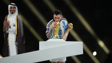 Argentina's Lionel Messi gives a kiss to the World Cup Trophy after beating France in a penalty shoot out during the FIFA World Cup final at Lusail Stadium, Qatar. Picture date: Sunday December 18, 2022. (Photo by Nick Potts/PA Images via Getty Images)