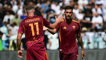 Roma's Italian midfielder #07 Lorenzo Pellegrini celebrates with Roma's Irish forward #11 Evan Ferguson after scoring his team's first goal during the Italian Serie A football match between Lazio and Roma at the Olympic stadium in Rome, on September 21, 2025. (Photo by Tiziana FABI / AFP)