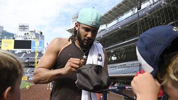 Fernando Tatis Jr. of the San Diego Padres signs autographs before a game against the Colorado Rockies August 3, 2022 at Petco Park in San Diego, California.