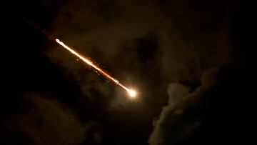 FILE PHOTO: A projectile is seen in the sky after Iran fired a salvo of ballistic missiles, amid cross-border hostilities between Hezbollah and Israel, as seen from Tel Aviv, Israel, October 1, 2024. REUTERS/Ammar Awad/File Photo