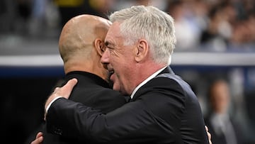 Real Madrid's Italian coach Carlo Ancelotti (R) hugs Manchester City's Spanish manager Pep Guardiola prior to the UEFA Champions League quarter final first leg football match between Real Madrid CF and Manchester City at the Santiago Bernabeu stadium in Madrid on April 9, 2024. (Photo by JAVIER SORIANO / AFP)