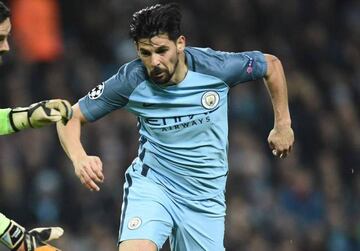 Manchester City's Spanish midfielder Nolito (R) vies with Celtic's Scottish goalkeeper Craig Gordon during the UEFA Champions League group C football match between Manchester City and Celtic at the Etihad Stadium in Manchester, northern England, on Decemb