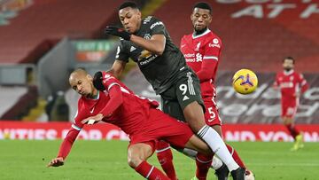 Soccer Football - Premier League - Liverpool v Manchester United - Anfield, Liverpool, Britain - January 17, 2021 Liverpool's Fabinho and Georginio Wijnaldum in action with Manchester United's Anthony Martial Pool